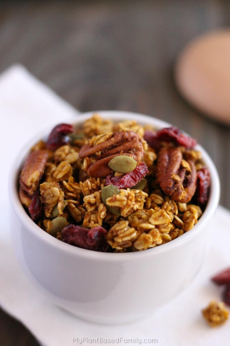 This oil-free Pumpkin Granola recipe has the best fall flavors mixed in. Pumpkin spice, pecans and even cranberries!